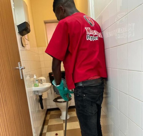 Cleaner working in ablution area